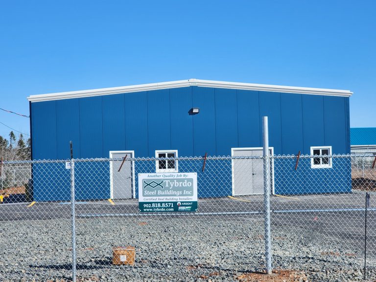 Blue warehouse with two white doors